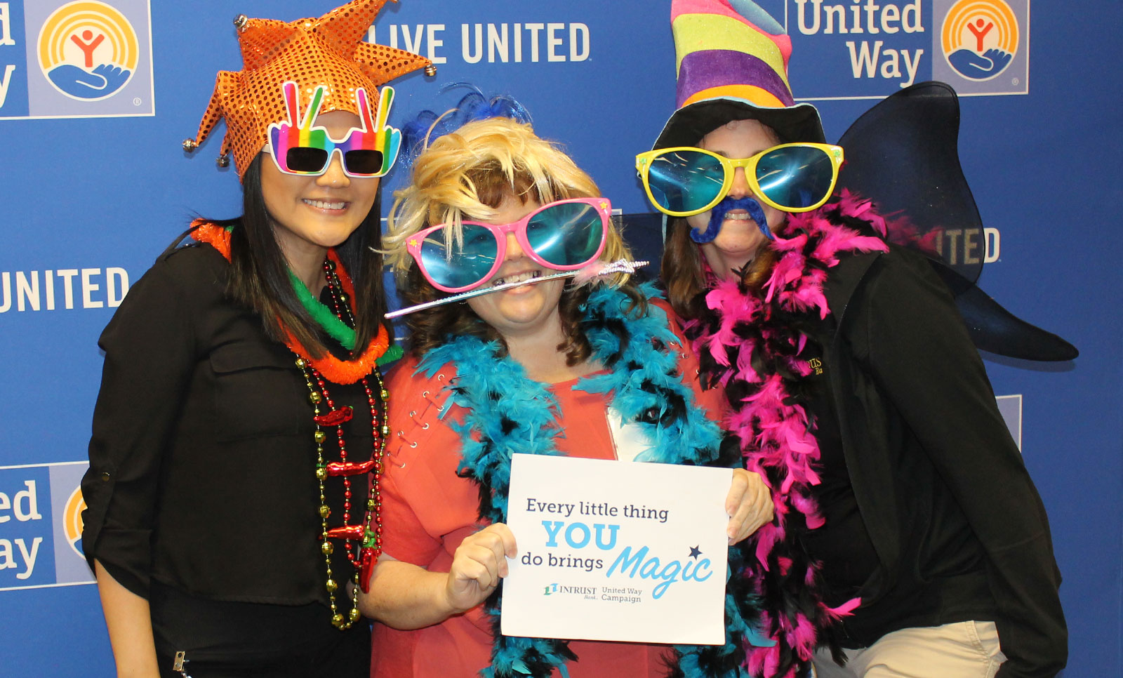 Employees taking part in the photo booth at our Agency Fair