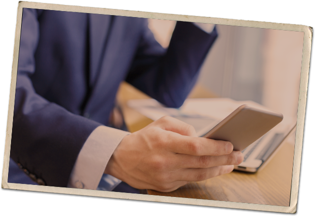 A business man holding a mobile phone